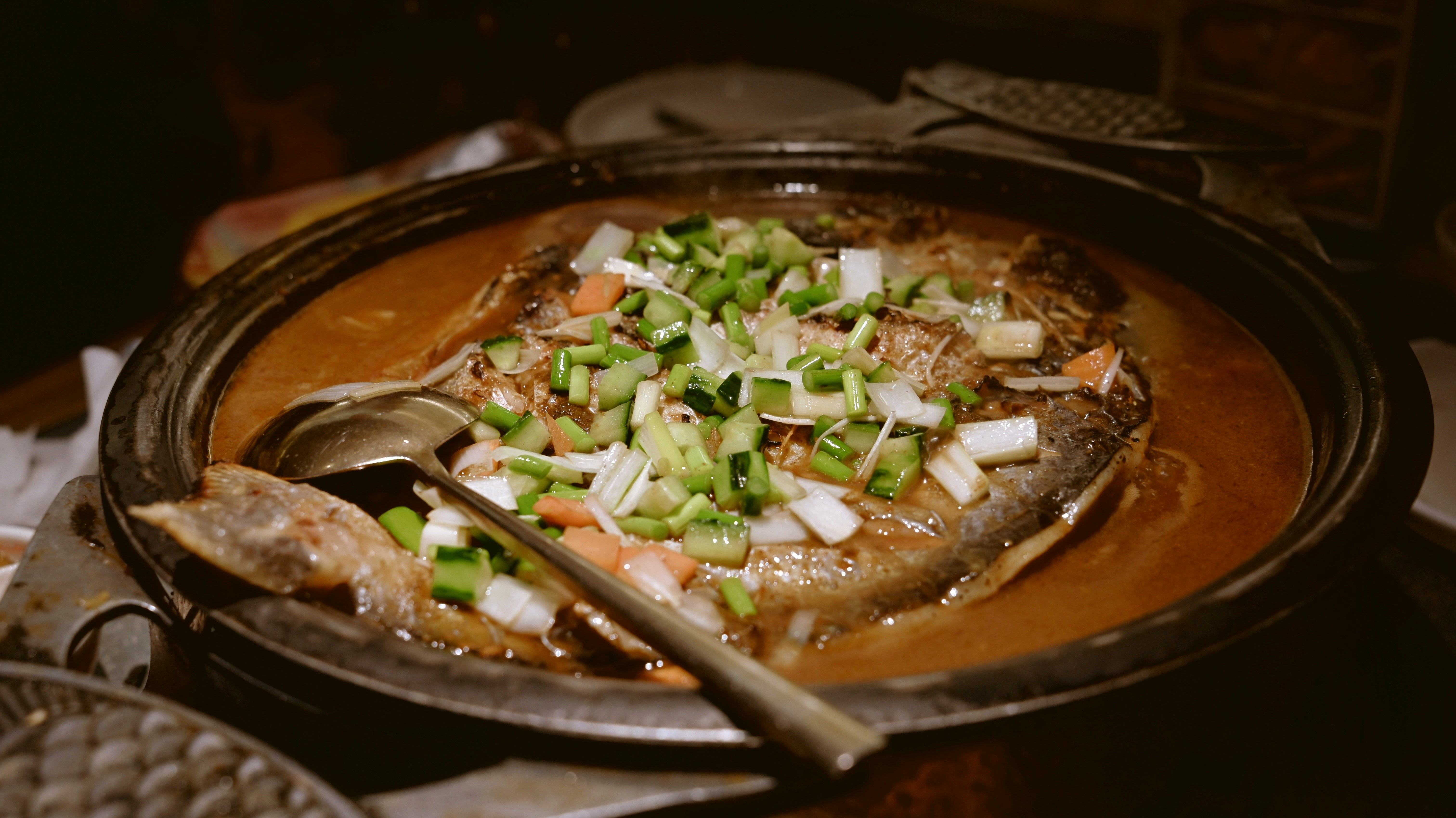 Whole steamed sea bass with ginger, scallions, and soy sauce
